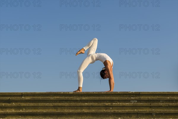 Young woman practising Hatha yoga