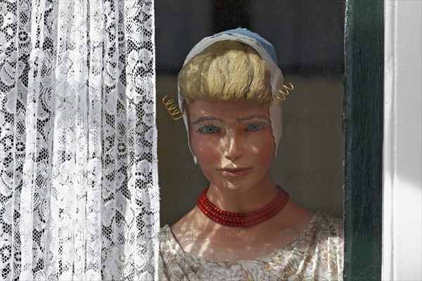 Display dummy in Dutch traditional costume in a window