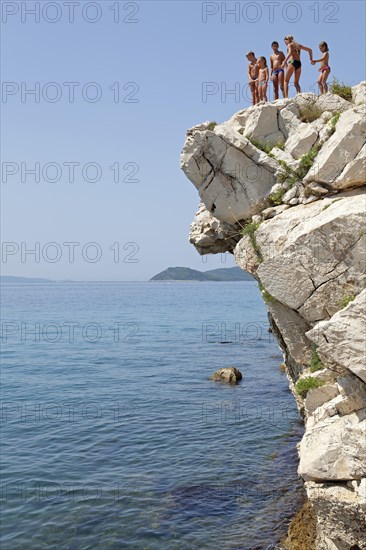 Children standing on cliff