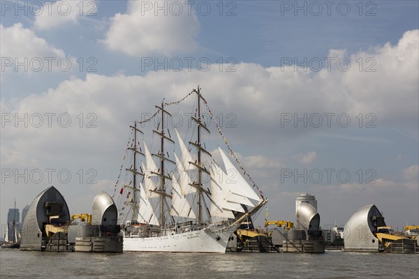 The Polish sail training ship Dar Mlodziezy passes through the flood protection barrier of the River Thames