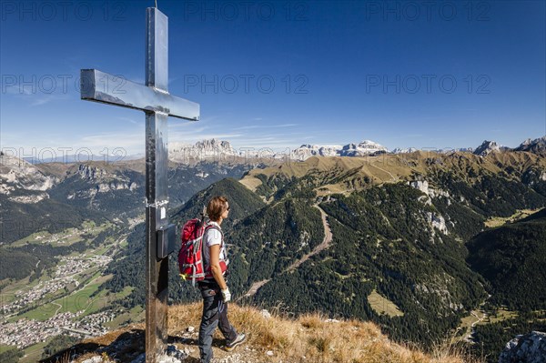 Mountaineer on the summit of Cima Dodici