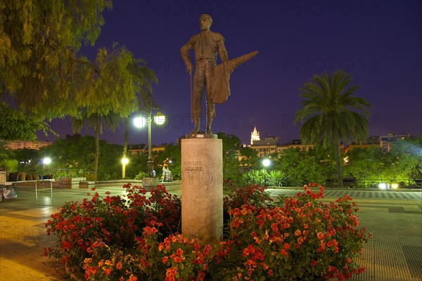 Statue of the bullfighter Pepe Luis Vazquez on the promenade of the Rio Guadalquivir