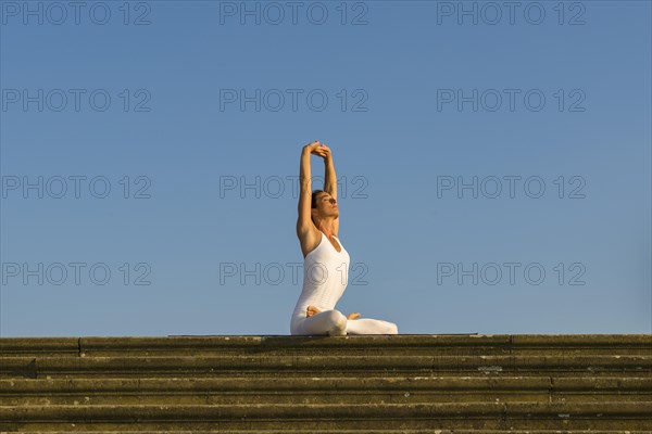 Young woman practising Hatha yoga