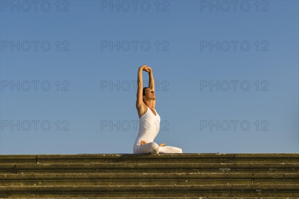 Young woman practising Hatha yoga