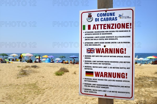 Funny German translation on a warning sign on the beach