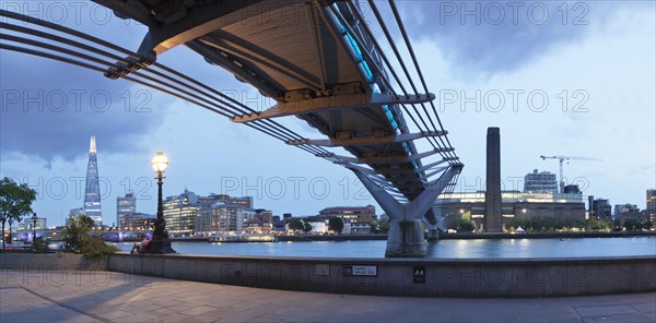 Millennium Bridge from below with views of The Shard skyscraper and Tate Modern