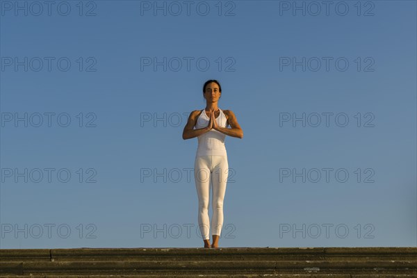 Young woman practising Hatha yoga