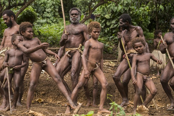 Men and boys of the Sa people dancing at the Land diving ceremony