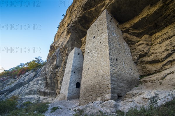 Chechen watchtowers under overhanging cliff on the Argun river