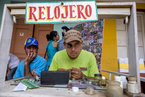 Watchmaker with their street workshop