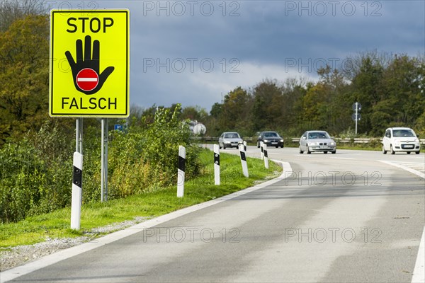 German signpost indicating not to enter the highway in the wrong direction