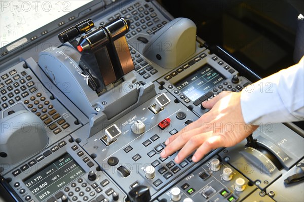 Cockpit with hand on the switch