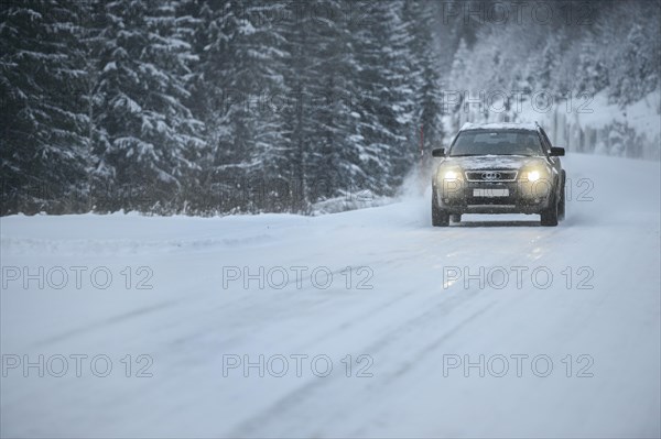 Truck driving on snowy road