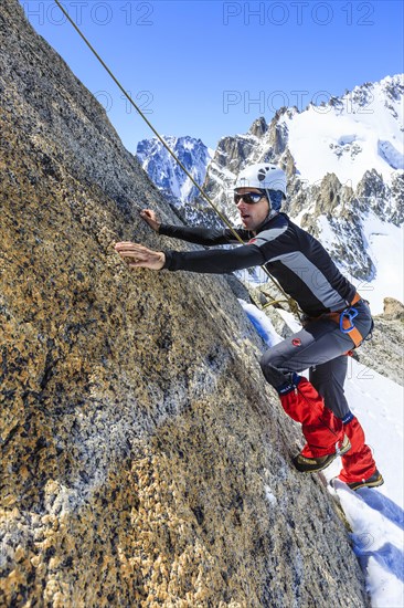 Climber climbing on a rock wall