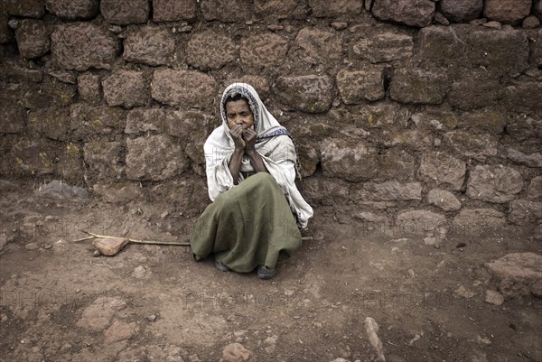 Woman begging for alms