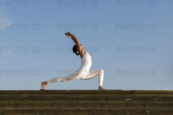 Young woman practising Hatha yoga