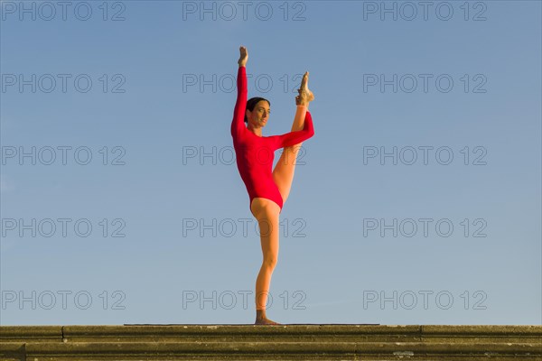 Young woman practising Hatha yoga