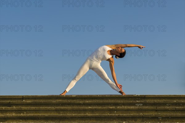 Young woman practising Hatha yoga