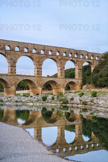 Pont du Gard Roman aqueduct over Gard River in evening light