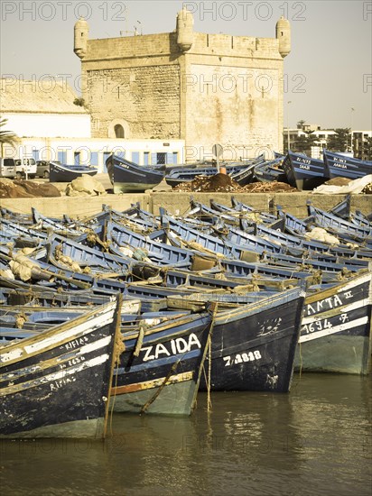 Old blue fishing boats in the port of Essaouira