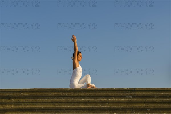 Young woman practising Hatha yoga