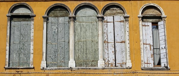 Shuttered Palladian windows