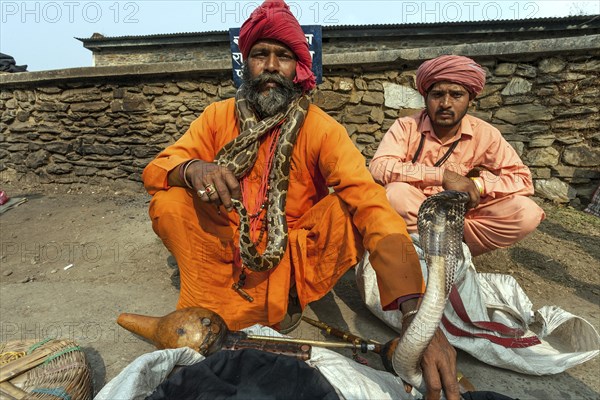 Snake charmer with a cobra