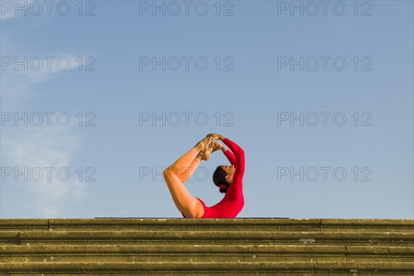 Young woman practising Hatha yoga