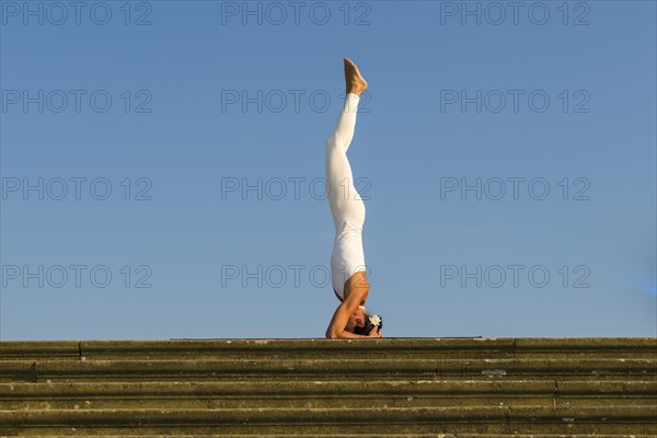 Young woman practising Hatha yoga