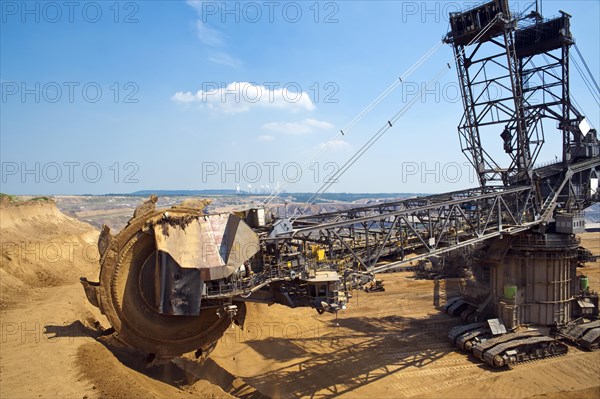 Bucket-wheel excavator on the edge of an opencast pit