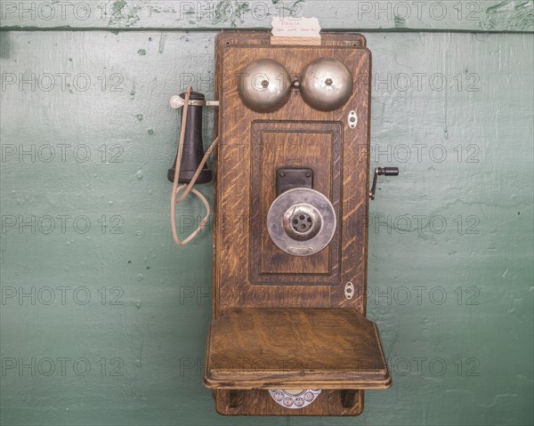 Old telephone with crank in the Museum City