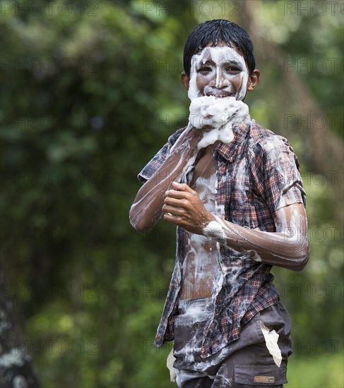 Boy covered in soap