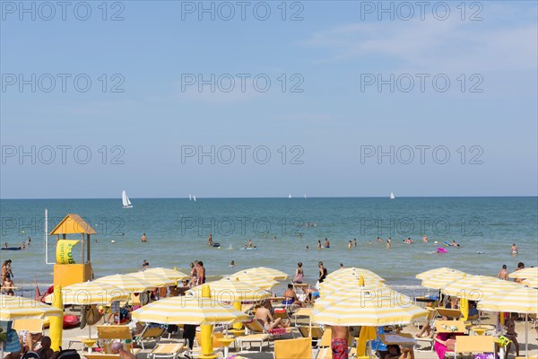 Bathers and parasols on the beach