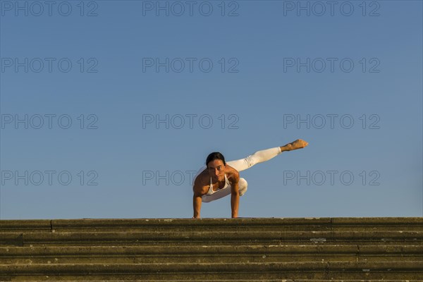 Young woman practising Hatha yoga