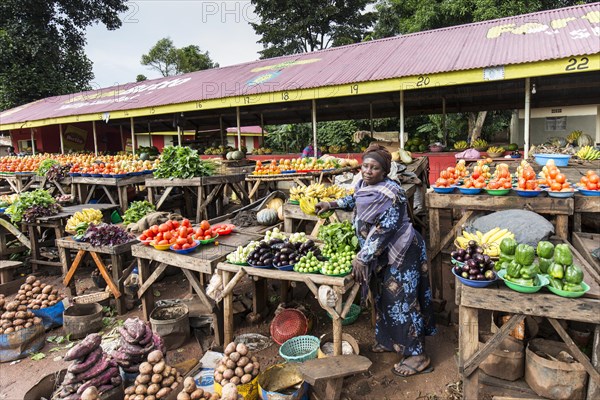 A woman selling vegetables on a street market