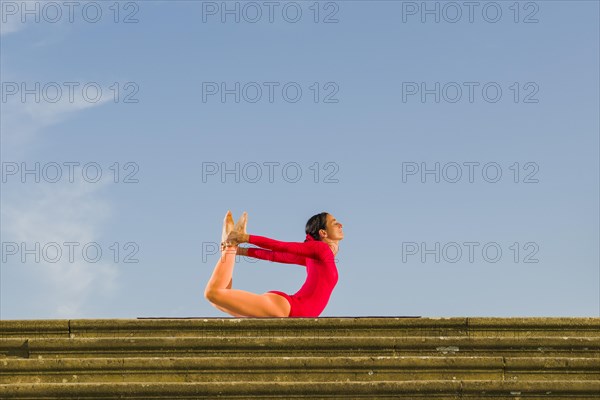 Young woman practising Hatha yoga