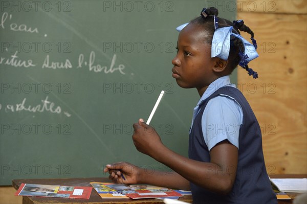 Student in a school for earthquake refugees