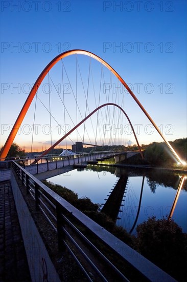 Illuminated double arch bridge over the Rhine-Herne Canal