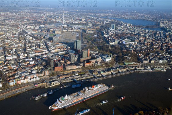Cruise ship Queen Victoria on the Elbe in front of the city center with television tower and Alster