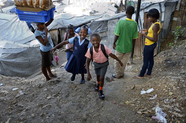 Brother and sister in school uniform on the way to school