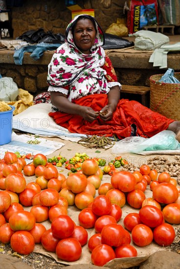 Market woman selling her vegetables
