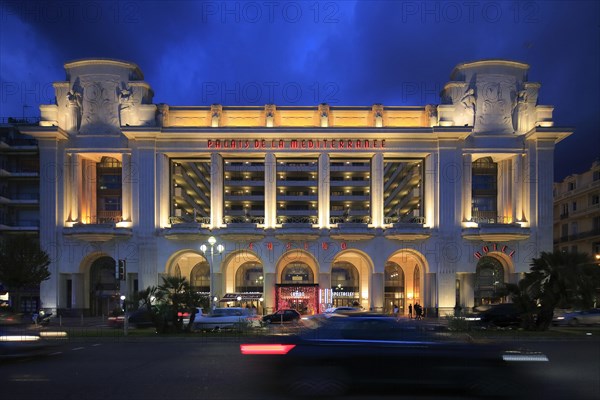 Hotel and Casino Palais de la Mediterranee on the Promenade des Anglais in the evening