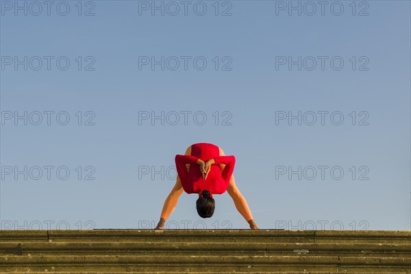 Young woman practising Hatha yoga