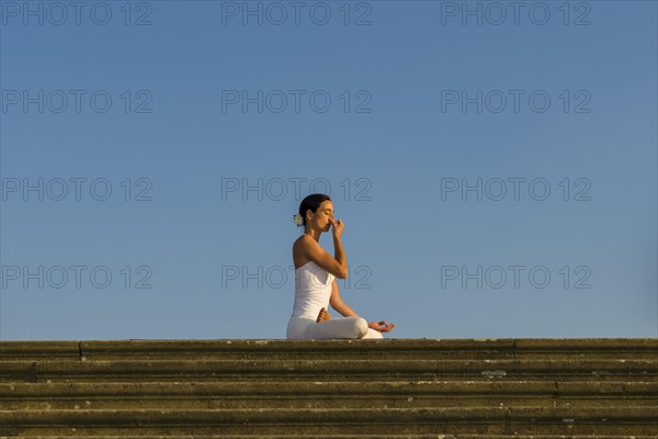 Young woman practising Hatha yoga