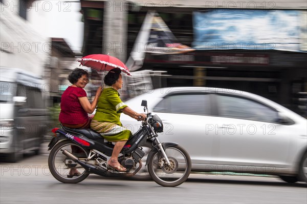 Two women on a motorcycle