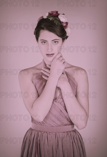 Beauty portrait of a young woman with flowers in her hair