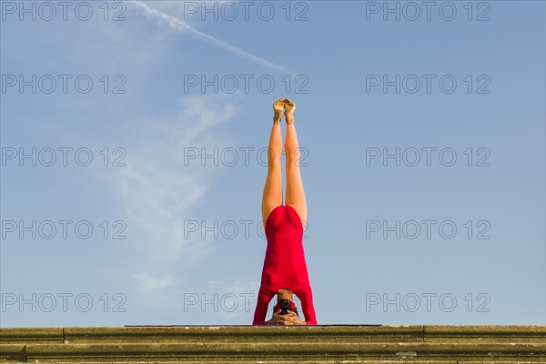 Young woman practising Hatha yoga