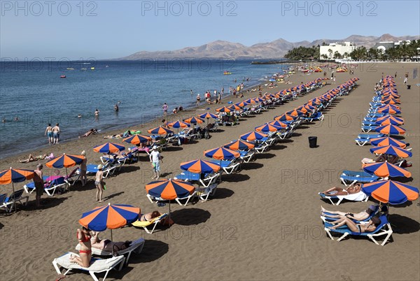 Playa Blanca beach with parasols and sun loungers