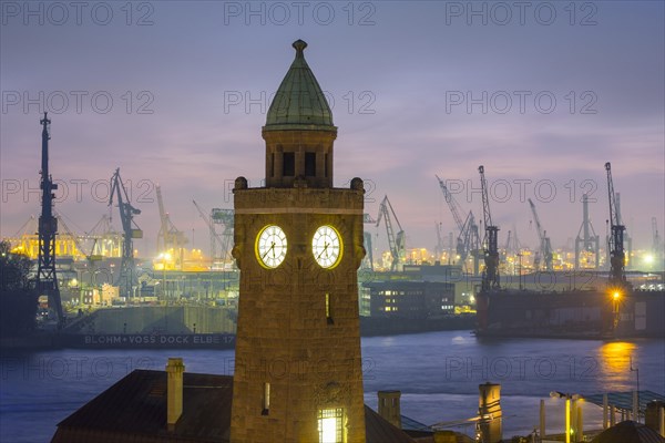 Tower of St. Pauli Landungsbrucken and the Elbe River at dusk