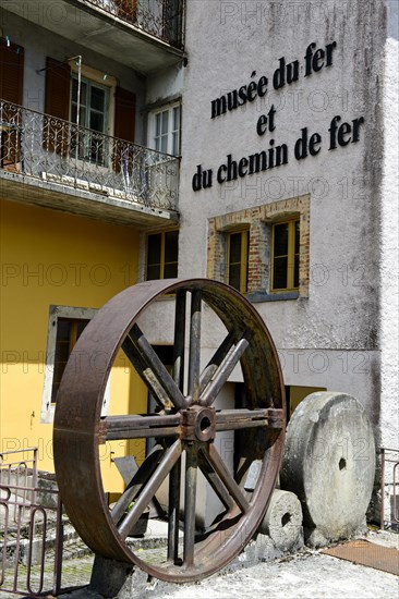 Iron wheel and grinding stones at the entrance to the Iron and Railway Museum